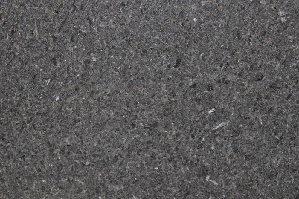 Black Pearl — Deep charcoal base with silver mica flecks — pairs with white and wood-grain cabinets.