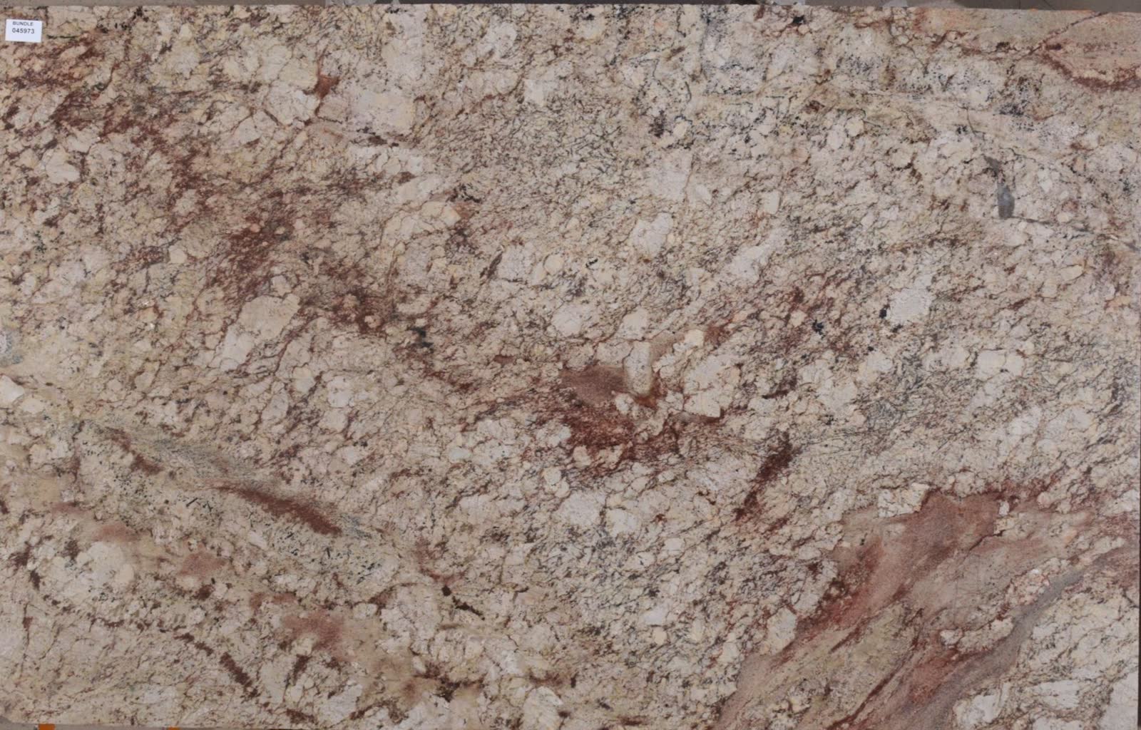 Typhoon Bordeaux granite slab with flowing burgundy and gold veining