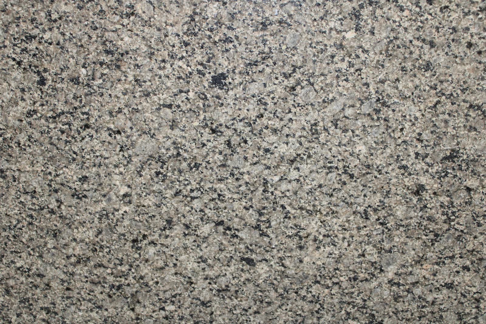 Verde Fusion — Green and bronze veining that works with rustic and craftsman kitchens.