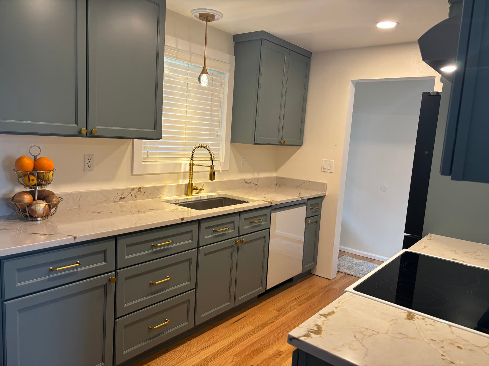 Beadboard — Cottage-style beadboard cabinetry with a light stone perimeter.