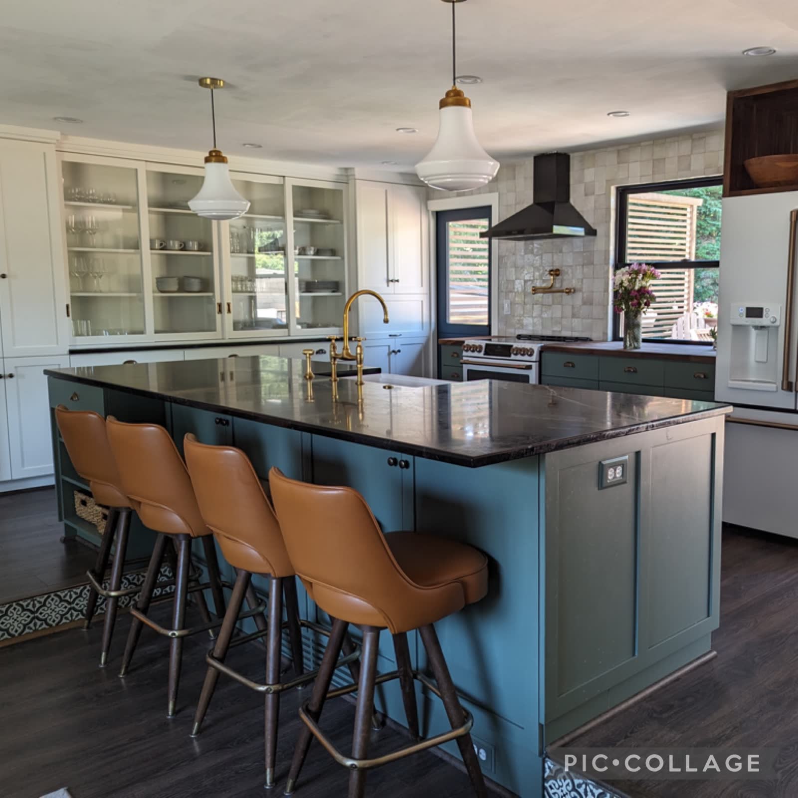 Sage green island kitchen with glossy zellige tile backsplash.
