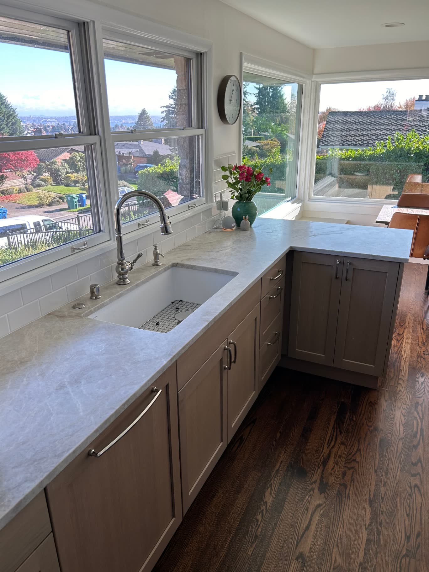 Kitchen with quartzite counters, farmhouse sink and panoramic view windows