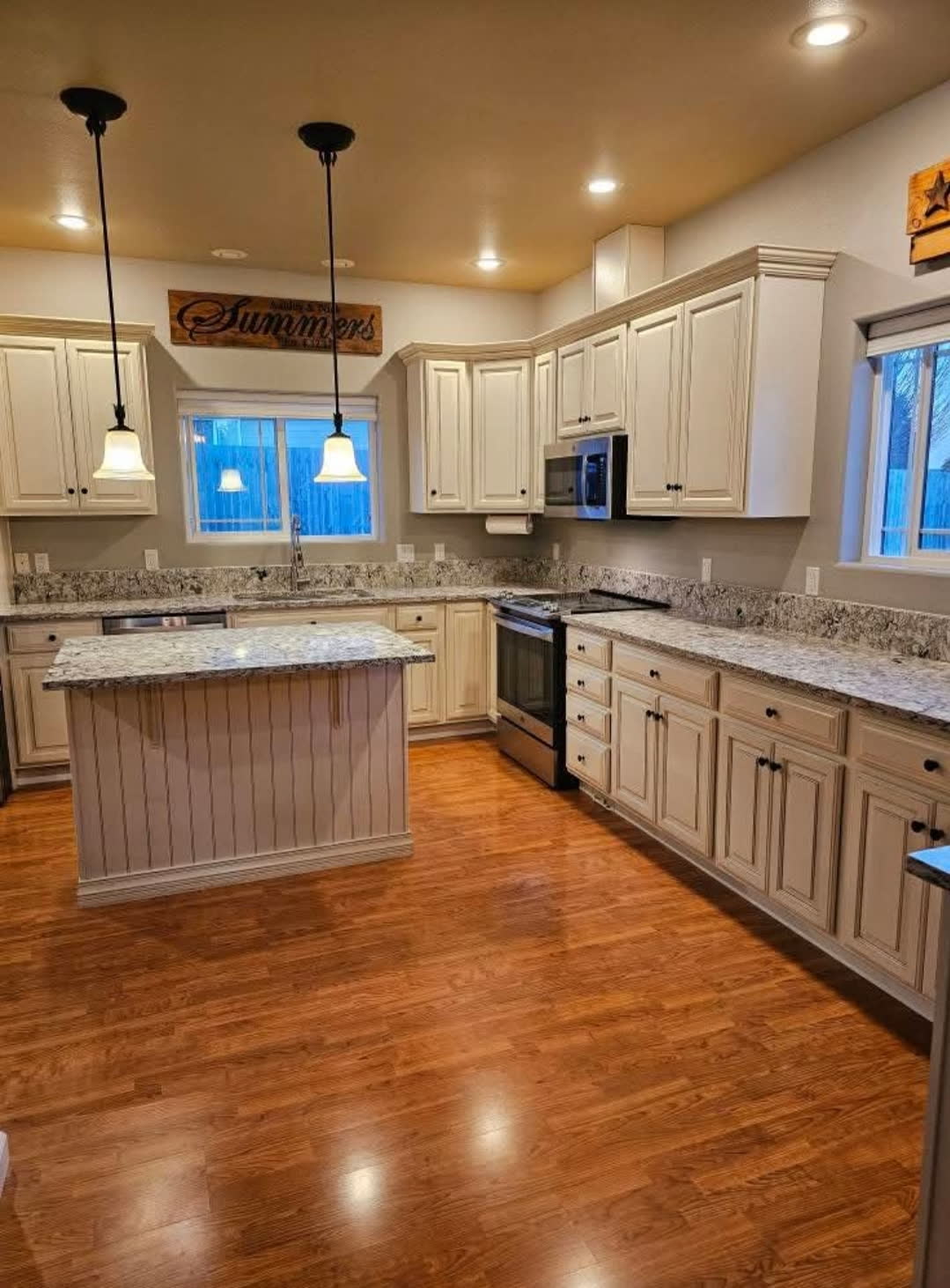 Raised panel — Traditional raised-panel doors with warm granite counters.
